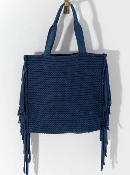 Show off your playful side this season with Shiraleah's Mavis Tote. Lined with long tails of fringe, this dynamic bag will draw eyes anywhere you go. With double shoulder straps and a roomy interior, you'll be set to carry all your essential items all summer long. Pair with the Mavis Zip Pouch and other items from Shiraleah to complete your look!
