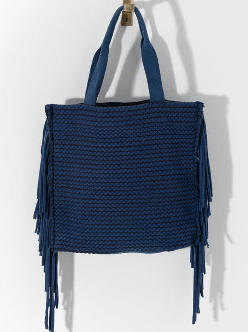 Show off your playful side this season with Shiraleah's Mavis Tote. Lined with long tails of fringe, this dynamic bag will draw eyes anywhere you go. With double shoulder straps and a roomy interior, you'll be set to carry all your essential items all summer long. Pair with the Mavis Zip Pouch and other items from Shiraleah to complete your look!