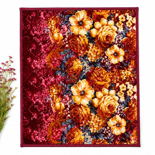 A square textile product, likely a scarf or small blanket, featuring a dense floral pattern with prominent orange and yellow flowers, deep red background areas, and dark blue-gray leaves. The textile is laid flat against a white background with a small de