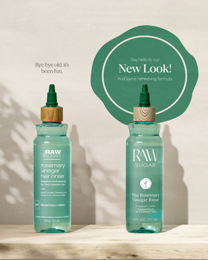 Two bottles of RAW Sugar Rosemary Vinegar Hair Rinse on a wooden surface with a light background.