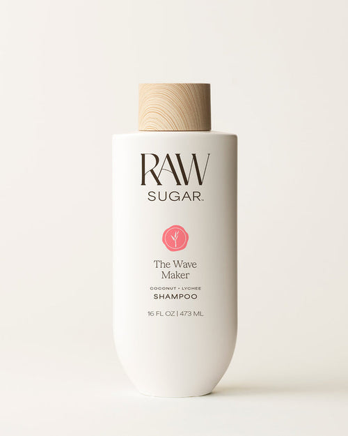 Bottle of Raw Sugar Wave Maker Shampoo on a cream background, designed to help cleanse hair with clean ingredients.