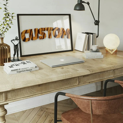 Framed "CUSTOM" print in realistic tiger stripe fur style, on a wooden desk with a laptop and decor.