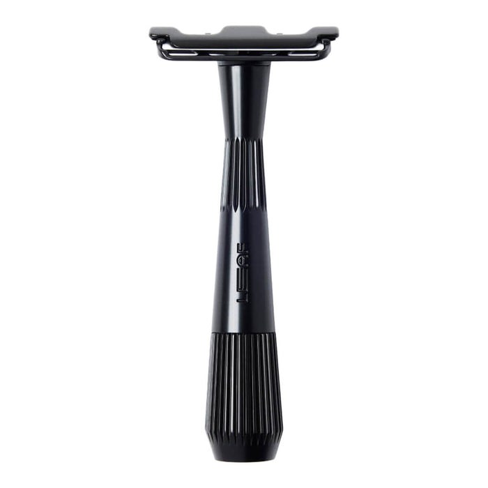 Black safety razor on a white background