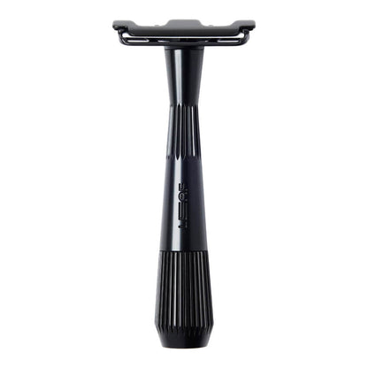 Black safety razor on a white background
