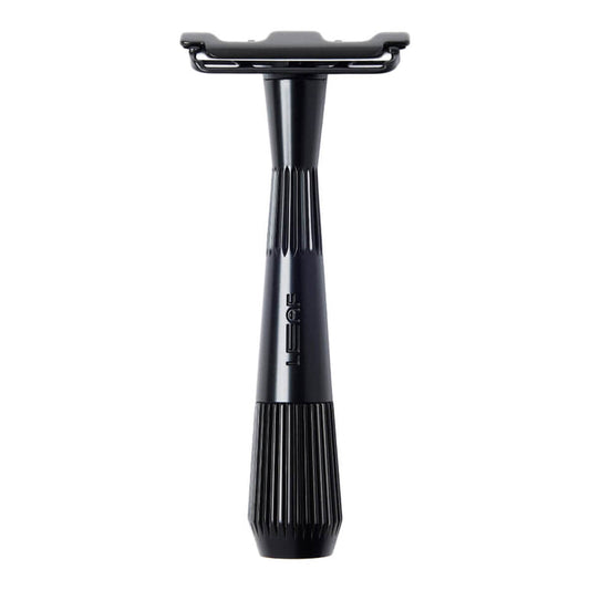 Black safety razor on a white background
