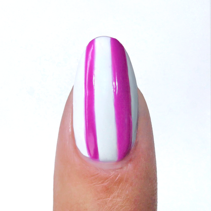 Ultra Violet liner used for neon purple vertical stripes on a sheer nude nail