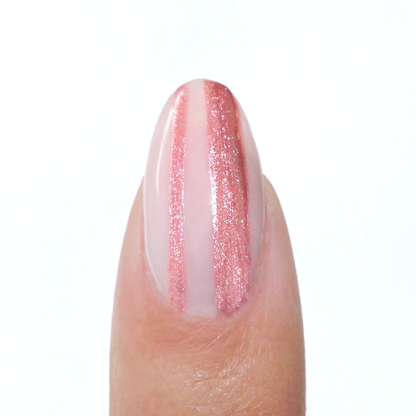 Venus Pink liner used for a metallic pink vertical stripe on a sheer nude nail