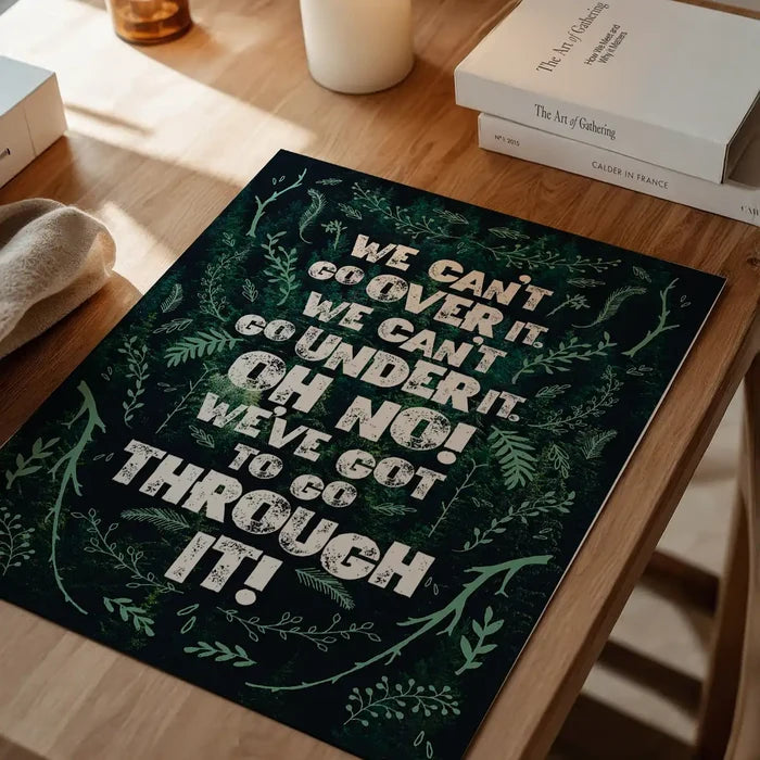 Green typography print with "We Can't Go Over It" quote and leafy border for a child's room.