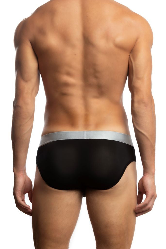 Man wearing a pair of black Jack Adams Zen Modal Horizontal Fly Briefs (back view) in front of white background
